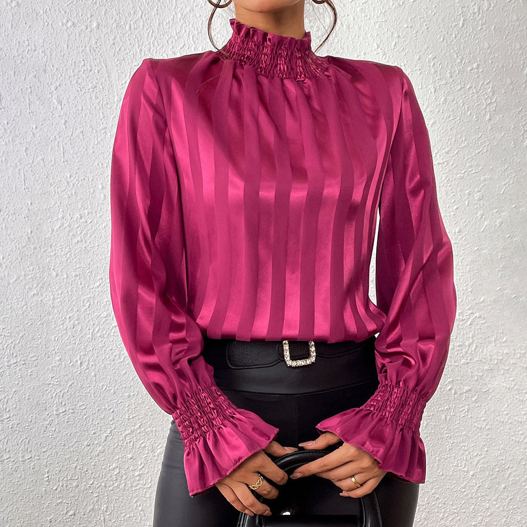 Camicetta donna elegante con collo alto e maniche a balze, perfetta per l'ufficio o serate chic.