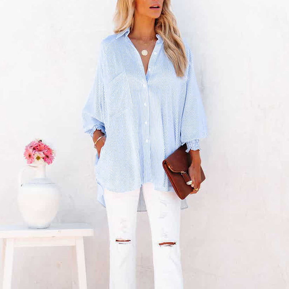 Elegante camicia casual oversize a righe per donna, versatile per ogni look. Comfort e stile chic.