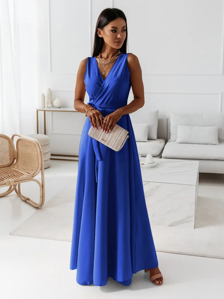 Abito da donna elegante con scollo a V e taglio lungo, ideale per serate, cerimonie o vestito cocktail.