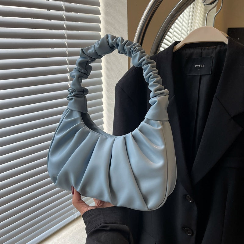 Borsa a spalla donna pieghettata lilla, design elegante e capiente. Accessorio moda.