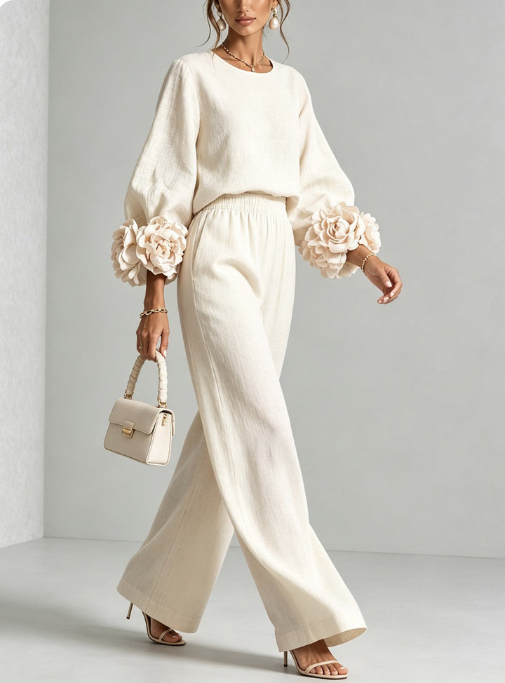 Completo donna floreale, top maniche corte e pantaloni larghi fluidi per un look elegante e casual chic in due pezzi.