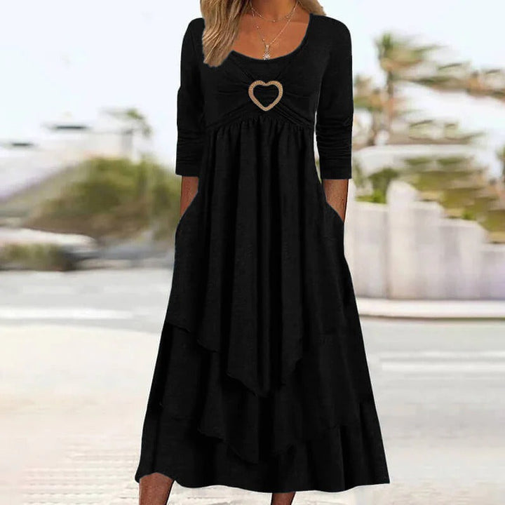 Abito midi donna Novalente, dettaglio cuore, gonna a balze. Perfetto per eventi eleganti in primavera.