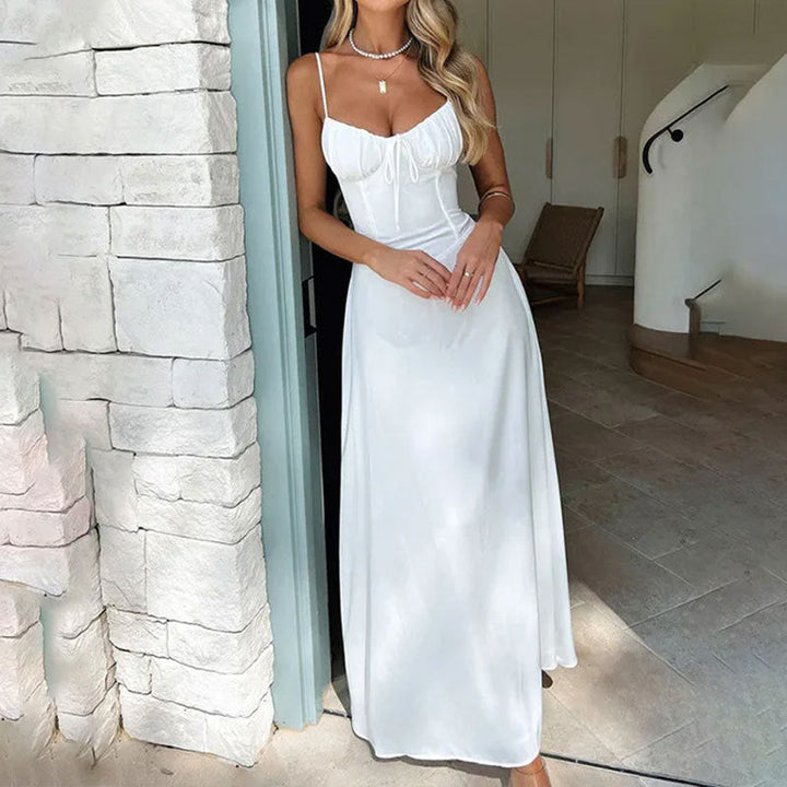 Abito maxi smanicato donna con corpino arricciato, leggero ed elegante, perfetto per l'estate e vacanze.