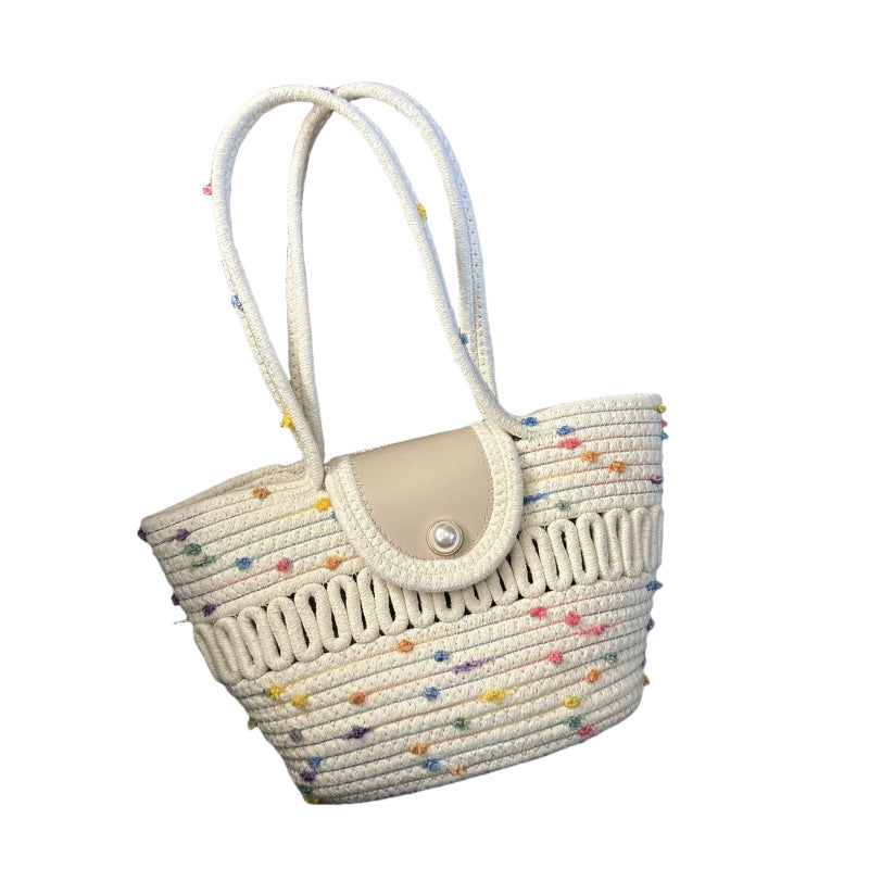 Borsa in paglia intrecciata da donna, colorata e capiente. Perfetta per lo shopping estivo o un look chic.