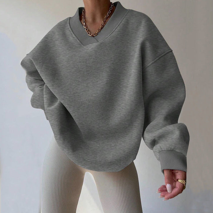 Maglione donna scollo tondo maniche lunghe, tinta unita. Essenziale per look casual o eleganti.