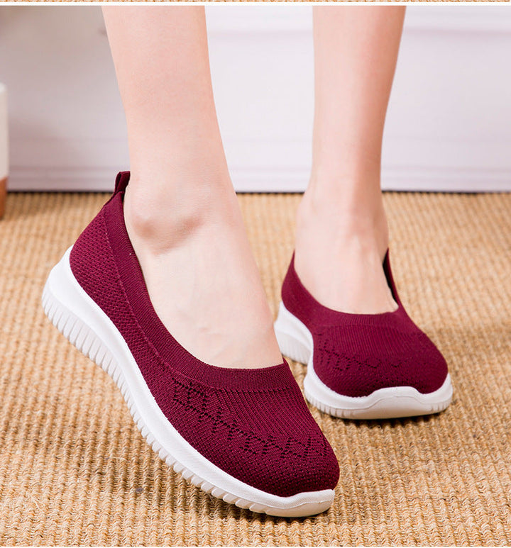 Sneakers slip-on da donna con supporto dell'arco e punta ampia per comfort quotidiano e camminata.