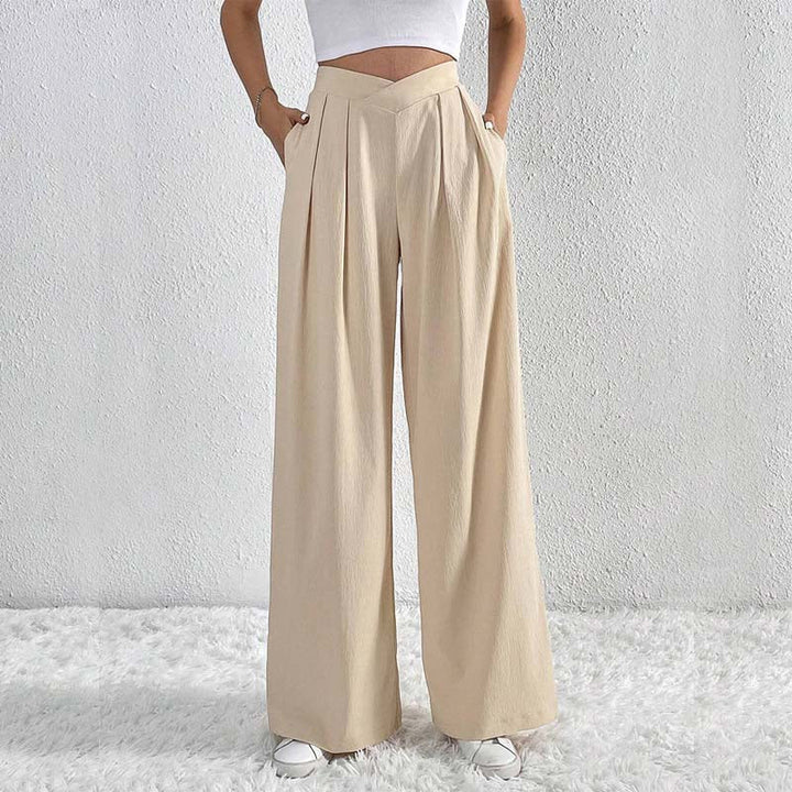Pantaloni larghi beige da donna a vita alta, leggeri ed eleganti, perfetti per la primavera estate.