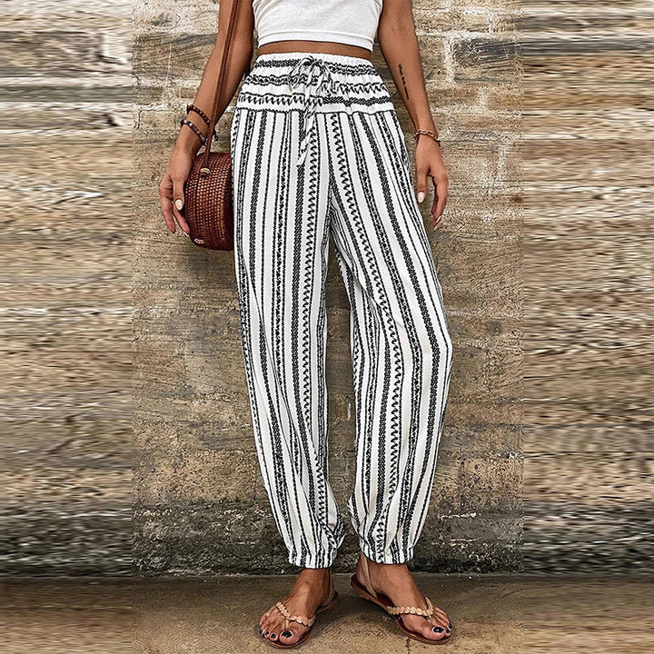 Tuta intera donna floreale a strisce con vita alta, perfetta per un look estivo casual ed elegante.