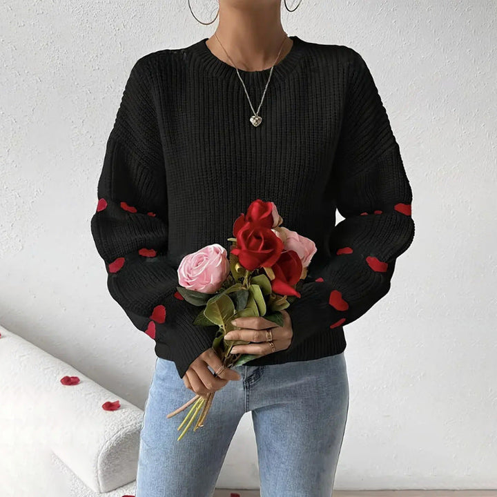 Maglione donna ampio girocollo con dettagli cuori, ideale per un look casual e confortevole in maglia invernale.