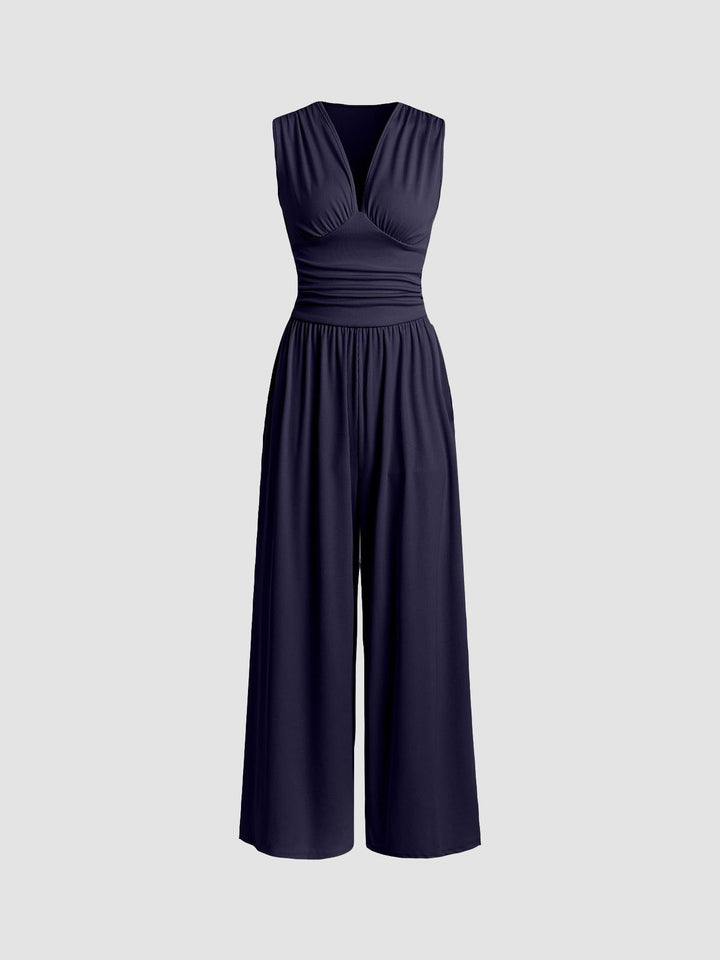 Tuta donna elegante senza maniche, lunga e fluida con gamba ampia. Perfetta per serate estive e moda donna.
