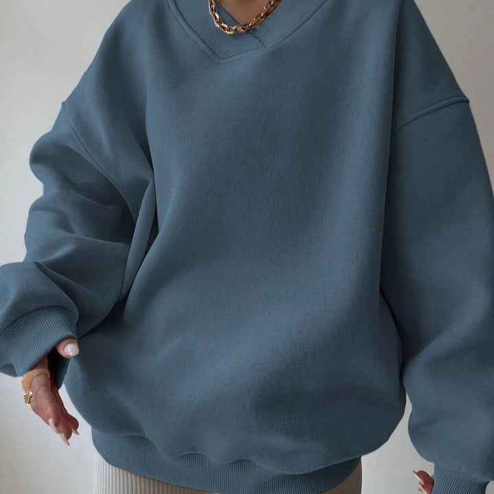 Maglia donna versatile a tinta unita con scollo tondo. Maniche lunghe, per comfort e stile.