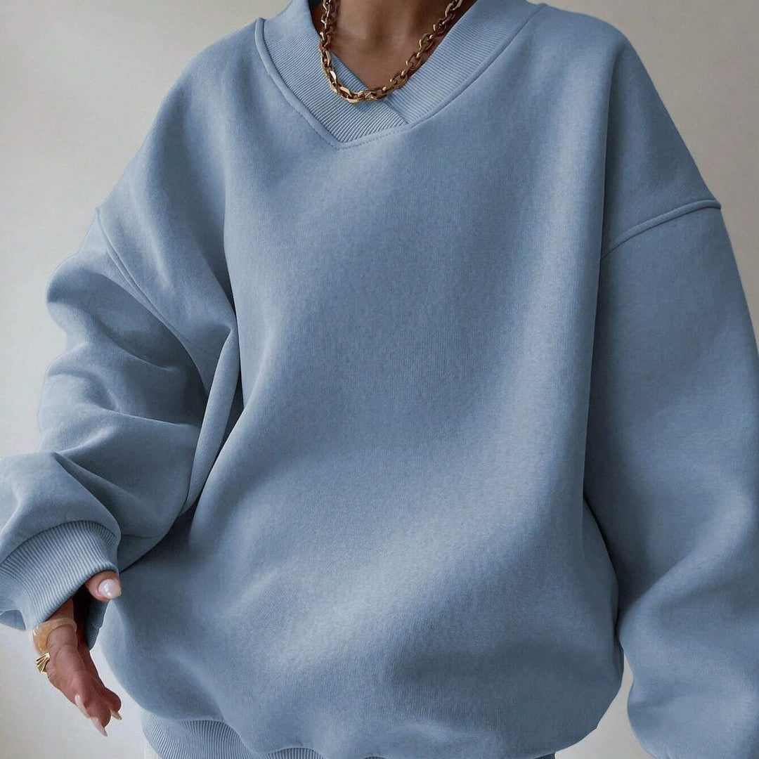 Maglia donna tinta unita con scollo tondo e maniche lunghe. Ideale per look essenziali.