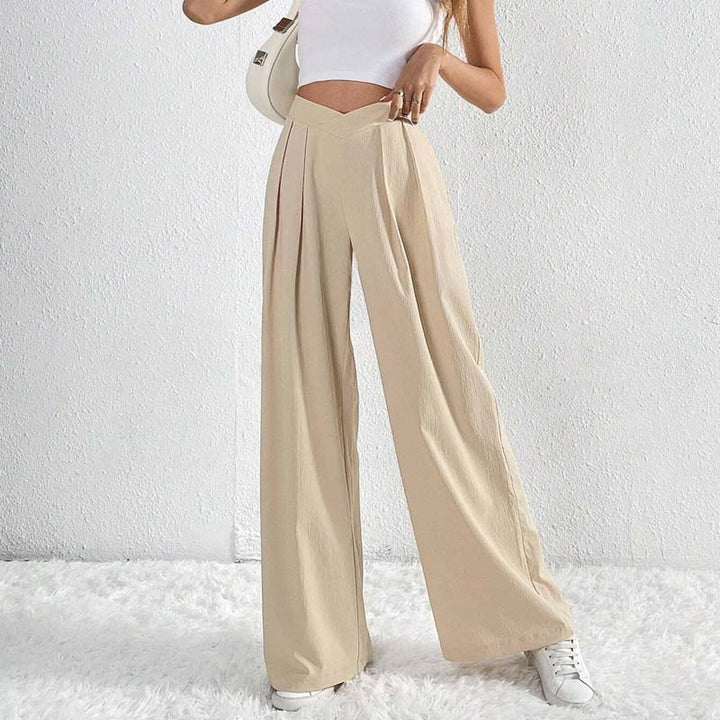 Pantaloni beige da donna, taglio gamba larga, vita alta. Leggeri e traspiranti, ideali per la stagione calda.