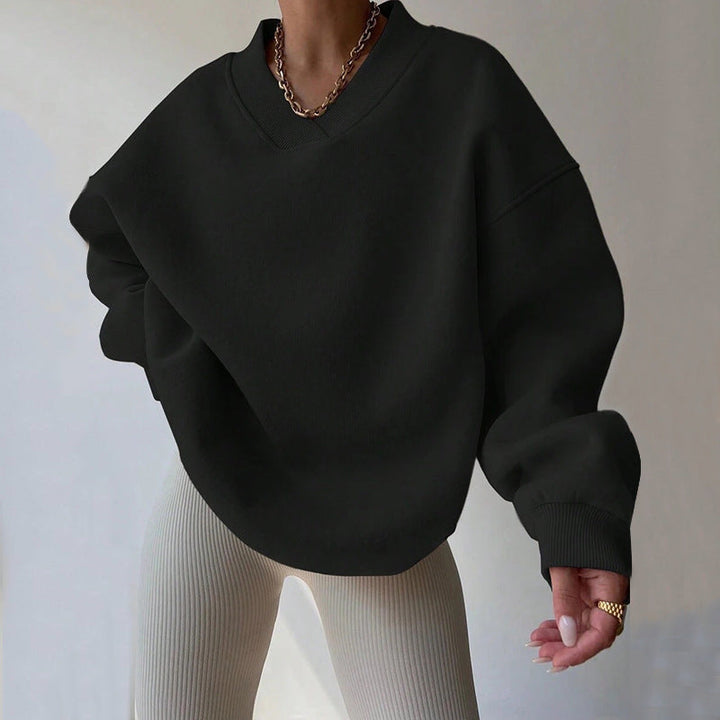 Maglia donna casual elegante, scollo tondo, maniche lunghe. Comfort e stile per l'autunno.