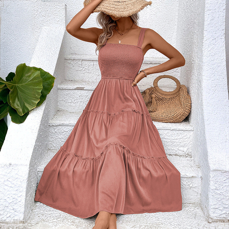 Vestito estivo donna con balza, schiena scoperta, silhouette fluida, per un outfit elegante e fresco.