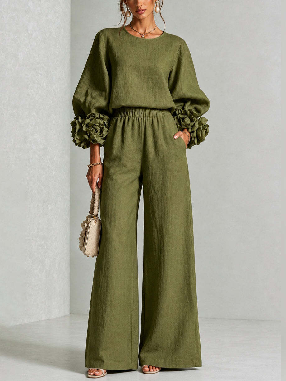 Completo donna floreale elegante, con top a maniche corte e pantaloni larghi a vita alta, in un fresco lino.