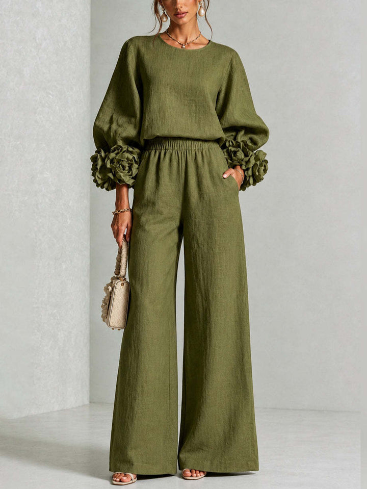 Completo donna floreale elegante, con top a maniche corte e pantaloni larghi a vita alta, in un fresco lino.