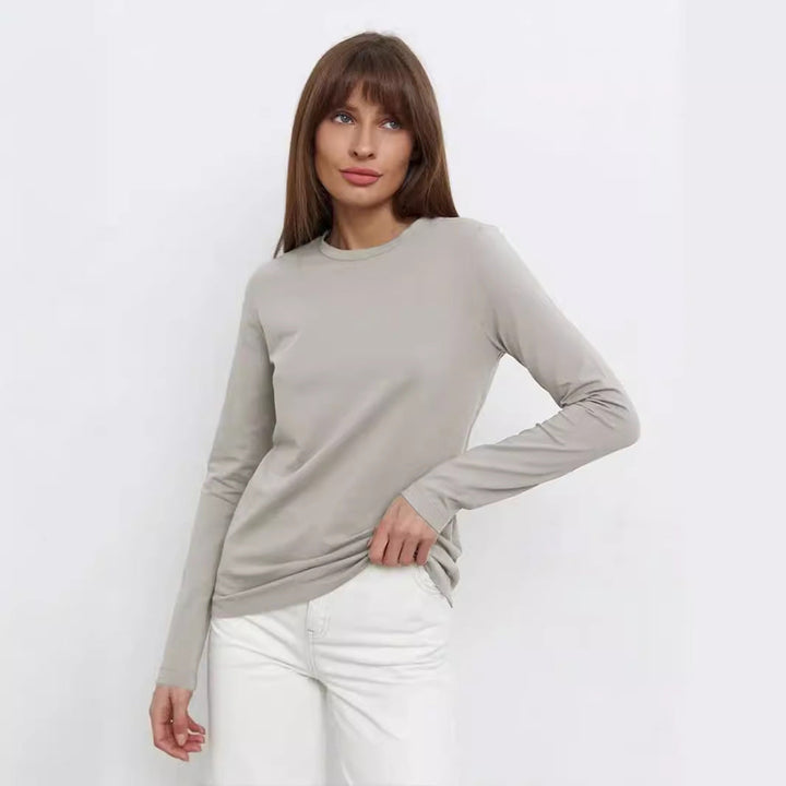 T-shirt donna a maniche lunghe versatile, stile moderno. Top casual elegante per autunno e inverno, comfort assicurato.
