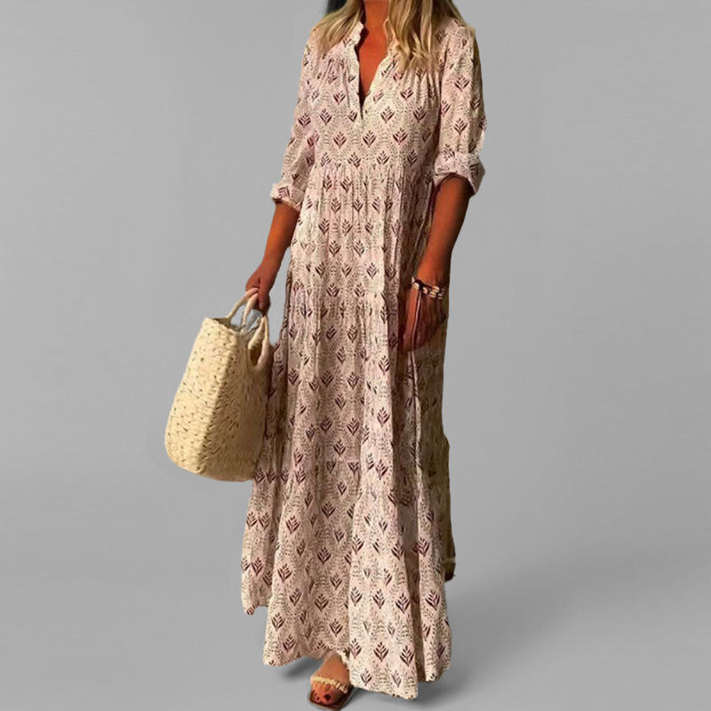 Abito lungo vintage da donna con scollo a V e manica 3/4. Maxi vestito estivo fluido con stampa chic per look casual.
