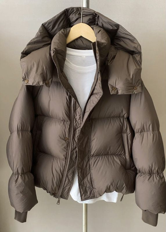 Giacca puffer donna marrone calda e confortevole con vestibilità larga, perfetta per l'outwear femminile invernale.