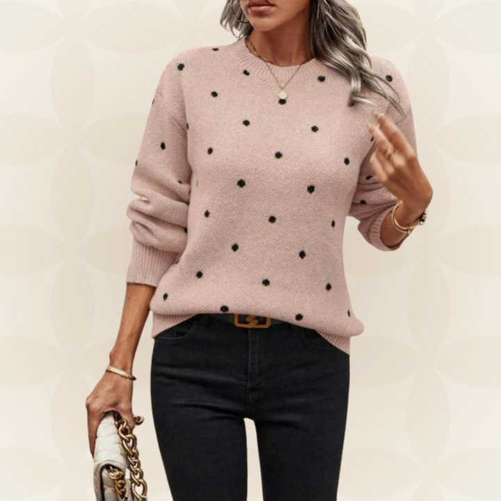 Morbido maglione donna a maniche lunghe con delicati pois e scollo tondo. Ideale per un comfort elegante e versatile.