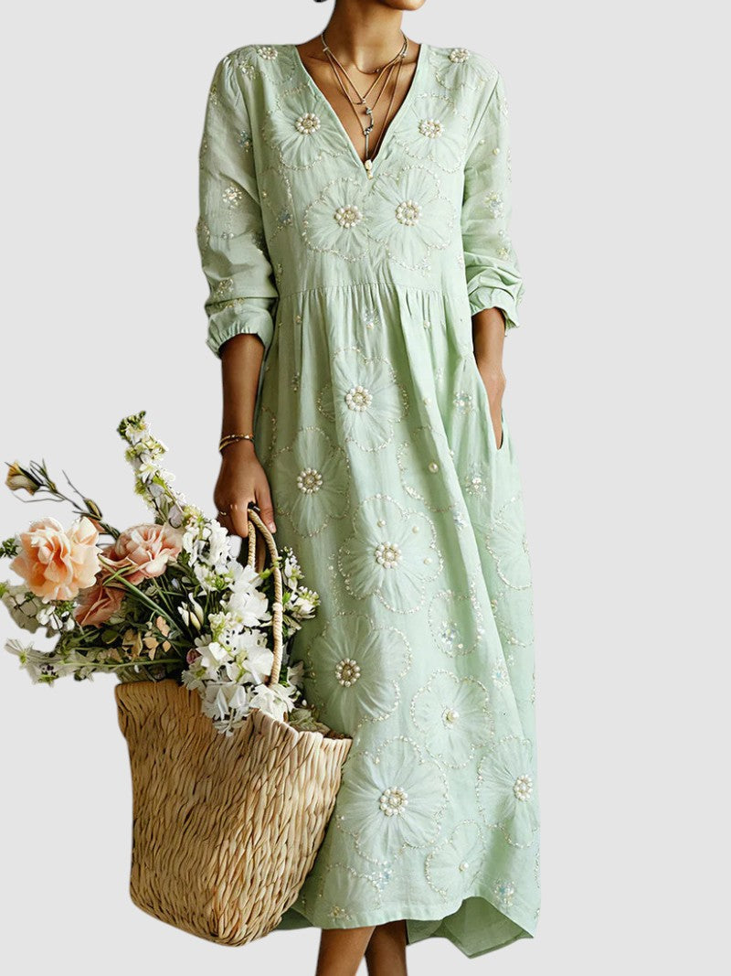 Vestito midi floreale verde da donna, perfetto per la moda autunnale e cerimonie. Eleganza e stile versatile.