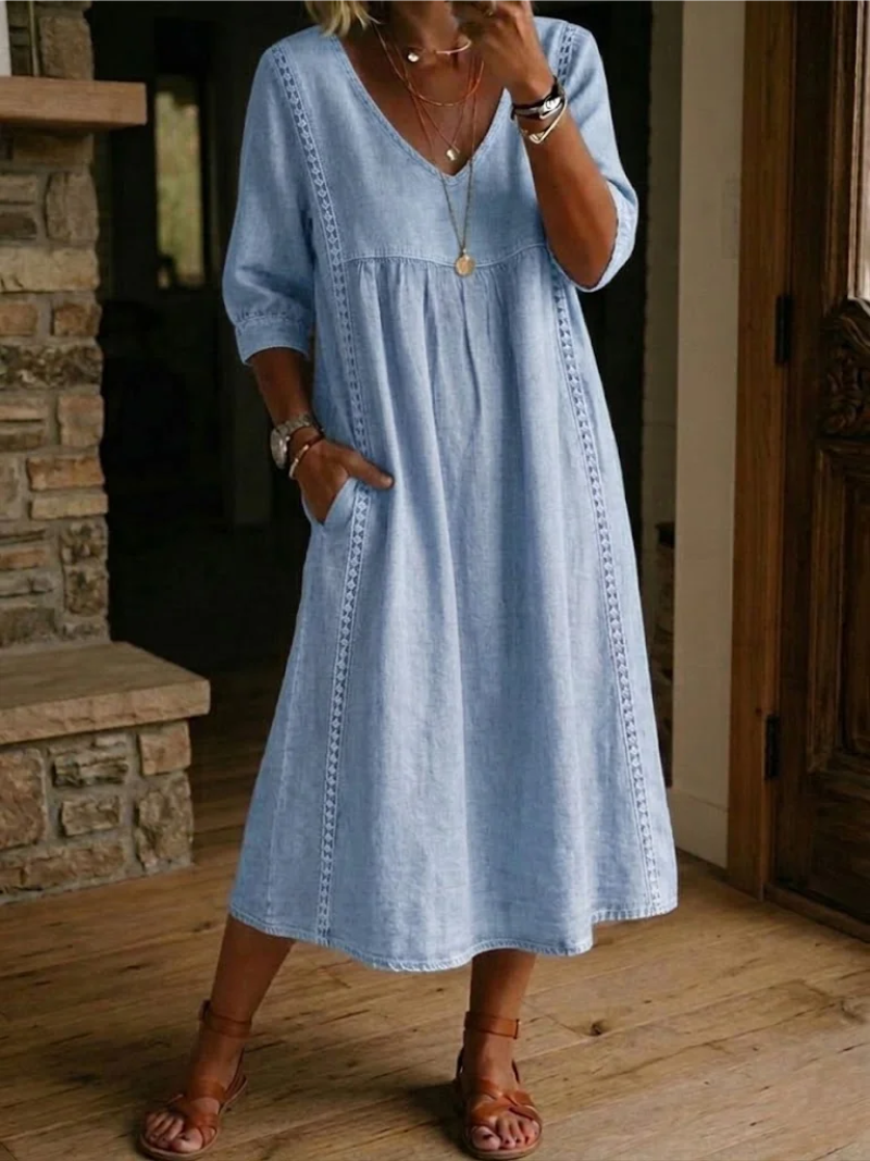 Vestito midi fluido da donna per l'estate, taglio casual e morbido, con tasche comode per un look femminile.
