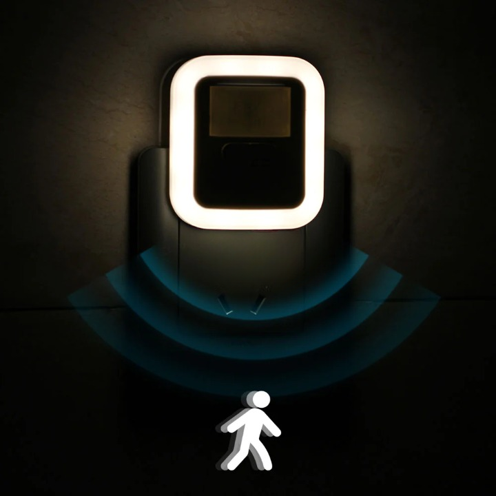 Luce notturna LED bianca con sensore di movimento, ideale per corridoi, scale e sicurezza notturna in casa.