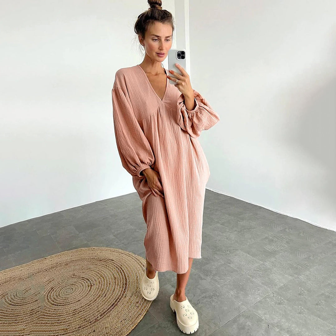 Vista posteriore abito midi casual donna, vestito ampio e confortevole. Ideale per un look estivo rilassato.