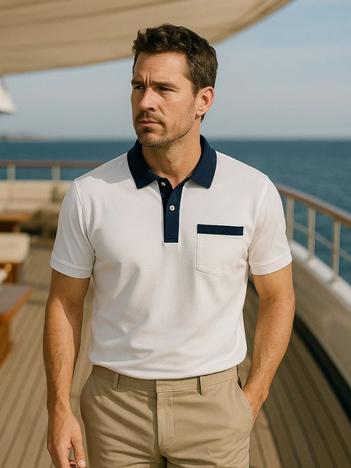 Abbigliamento uomo: polo smart casual, design sofisticato, colletto in contrasto per stile classico maschile.
