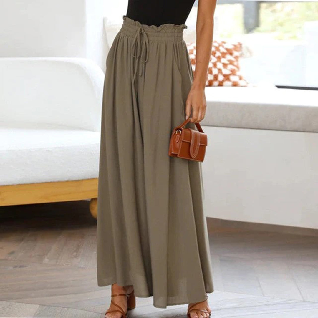 Eleganti pantaloni palazzo donna a vita alta e gamba larga, con coulisse per un comfort versatile.