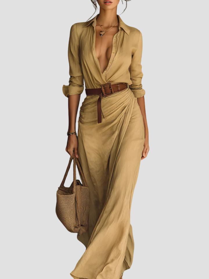 Abito chemisier lungo da donna in tessuto elegante, con bottoni e cintura, per uno stile moderno e raffinato.