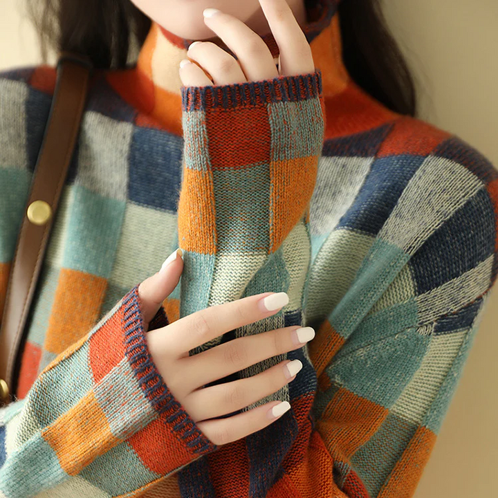 Pullover donna con collo alto protettivo e motivo a quadri, massimo comfort per l'autunno-inverno.