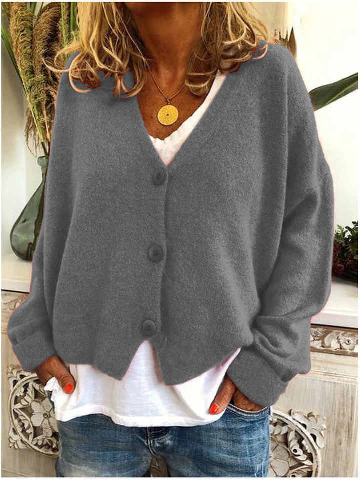 Cardigan donna caldo ed elegante in maglia, ideale per autunno/primavera. Offre comfort e stile versatile.