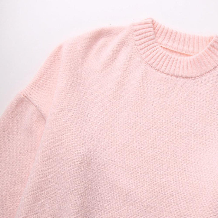 Pull rosa oversize scollo rotondo, abbigliamento donna elegante e comodo per la stagione fredda.