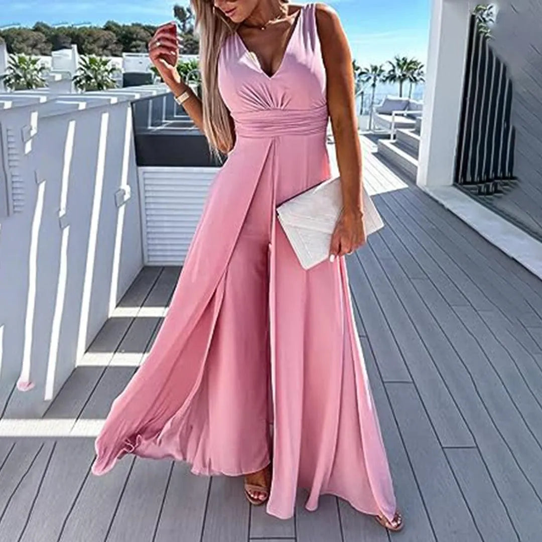 Comoda tuta lunga da donna a gamba larga, vita aderente. Ideale per un look fresco e alla moda in primavera estate.