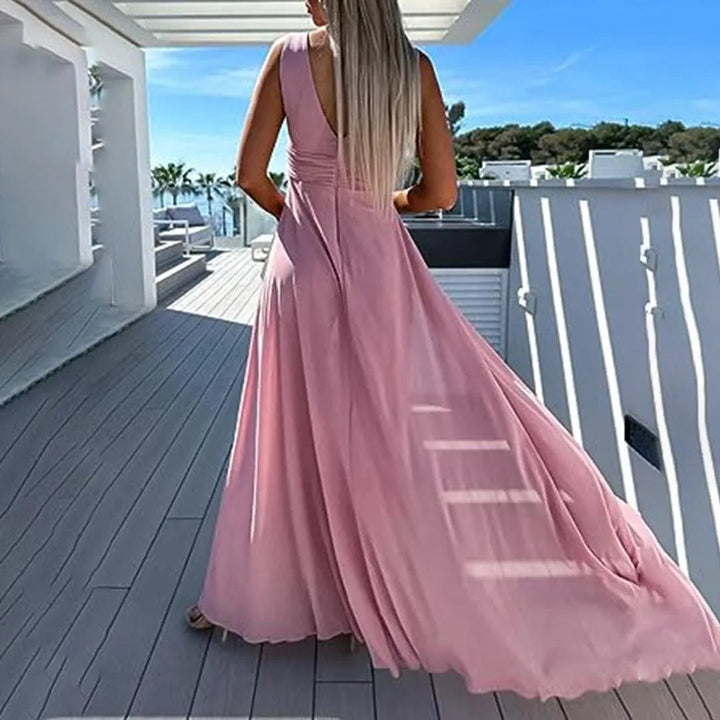 Tuta lunga donna azzurra a gamba larga, vita aderente per un comfort eccezionale. Outfit elegante e casual.