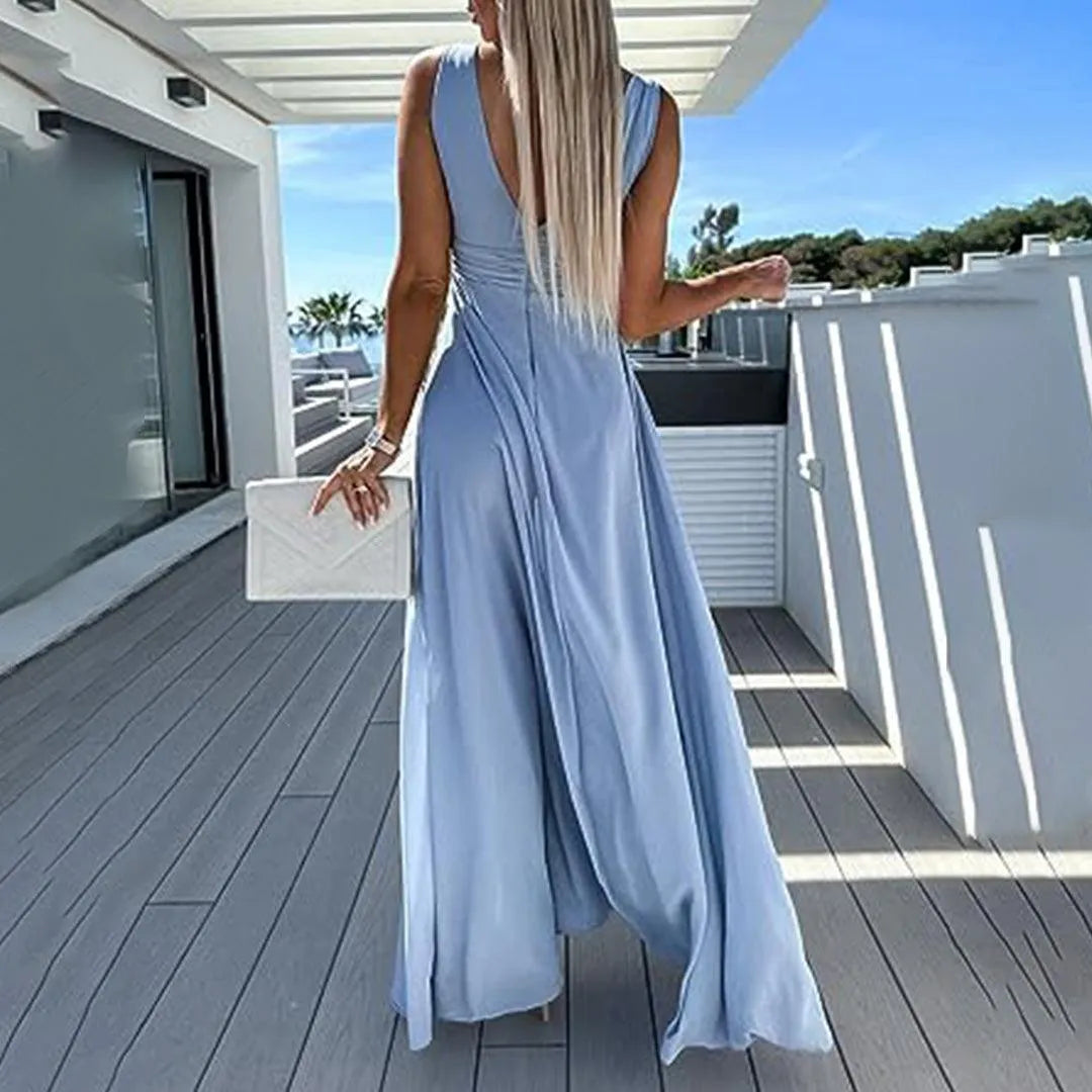 Elegante tuta donna a gamba larga con vita aderente. Perfetta per abbigliamento femminile casual-chic e moda versatile.