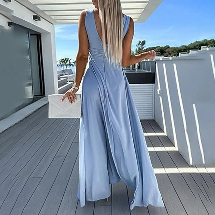 Elegante tuta donna a gamba larga con vita aderente. Perfetta per abbigliamento femminile casual-chic e moda versatile.