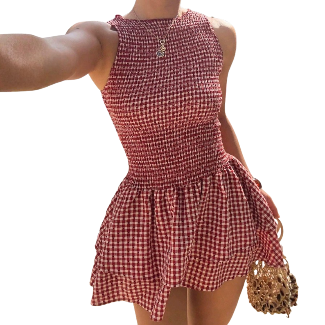Abito da donna elegante a quadri con spalle scoperte e maniche a sbuffo, perfetto per feste e occasioni chic.
