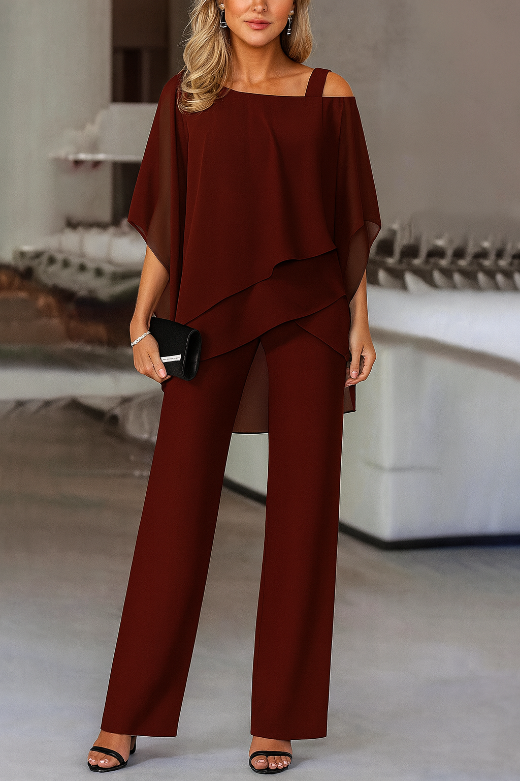 Pantaloni larghi e blusa elegante, un completo donna chic per un look raffinato. Ideale per un abbigliamento moderno.