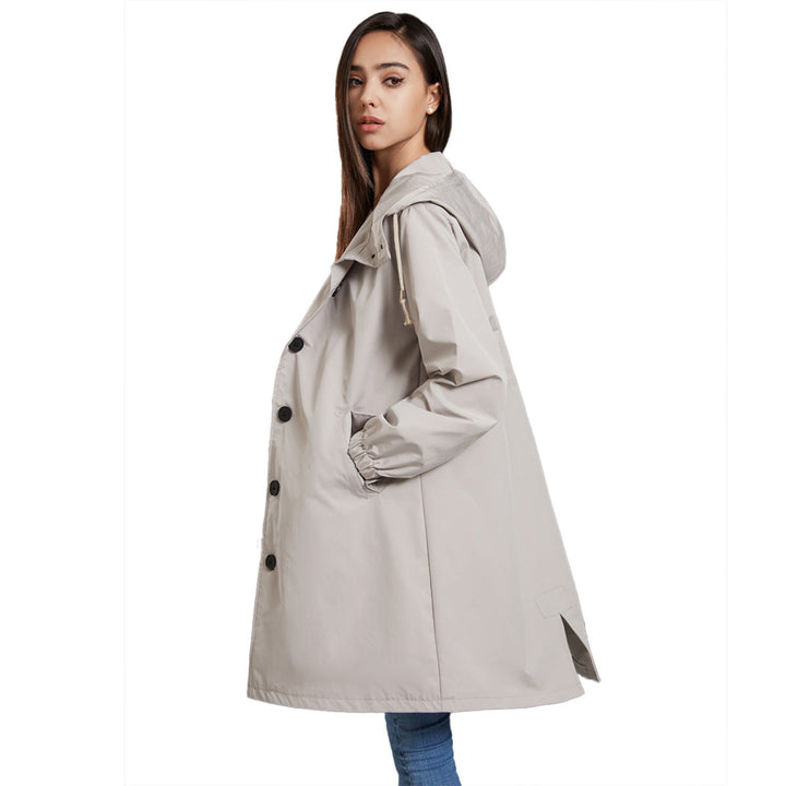 Giacca con cappuccio e bottoni, cappotto lungo donna per un look casual-elegante moda inverno.