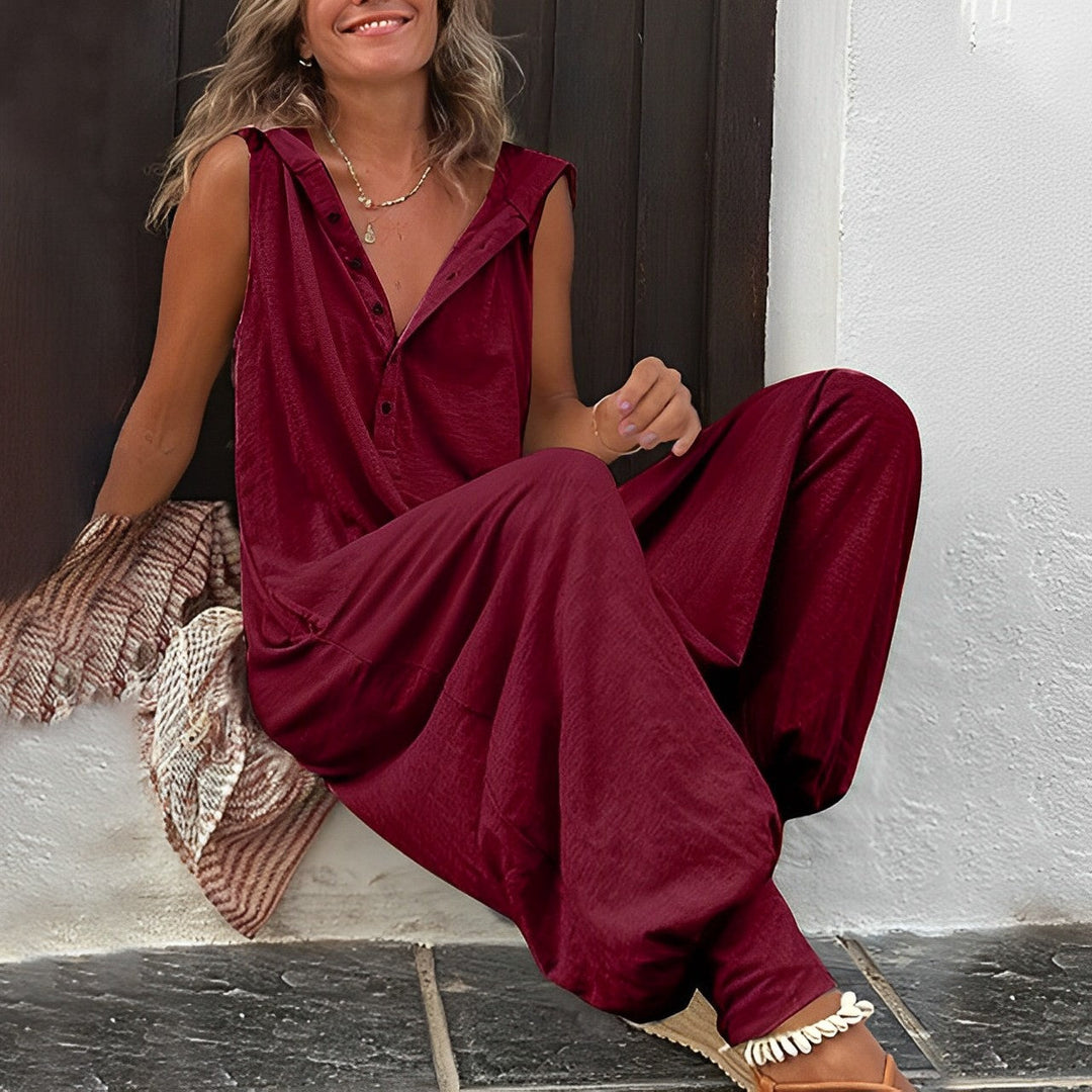 Monopezzo donna a gamba larga con cappuccio, ideale per un look estivo e una vestibilità ampia e comoda.