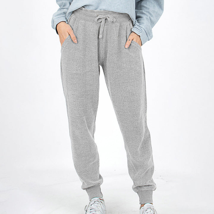 Pantaloni jogger donna stile vintage con vita elastica, comodi per ogni attività.