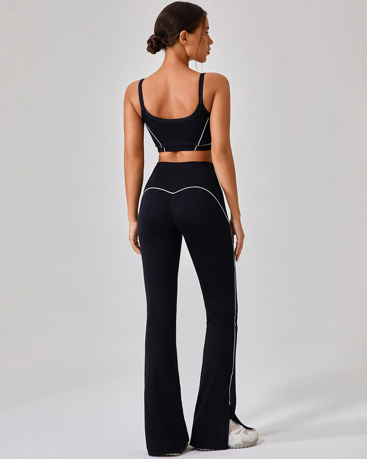 Leggings sportivi donna vita alta svasati, con spacco e piping nero a contrasto, perfetti per yoga.