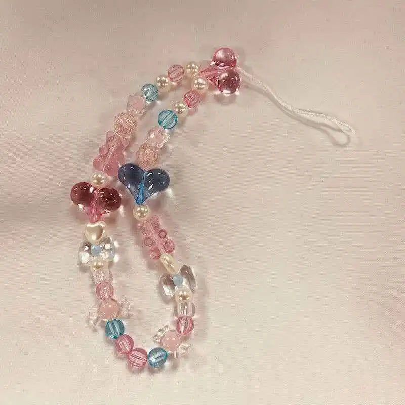 Catenella telefono donna, perline macaron e fiore, un accessorio versatile e alla moda, da non perdere.