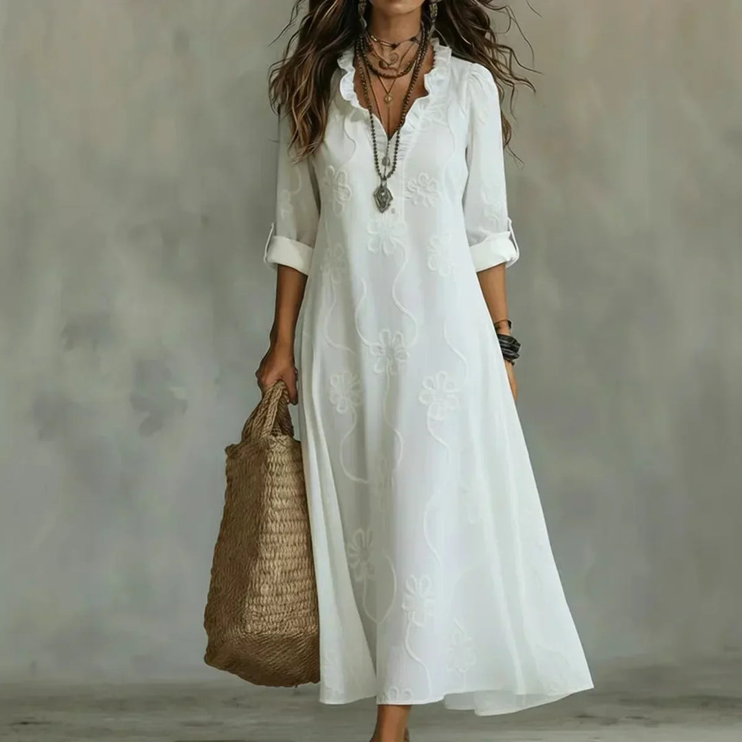 Elegante abito floreale lungo per donna, ideale per un look estivo casual o da vacanza.