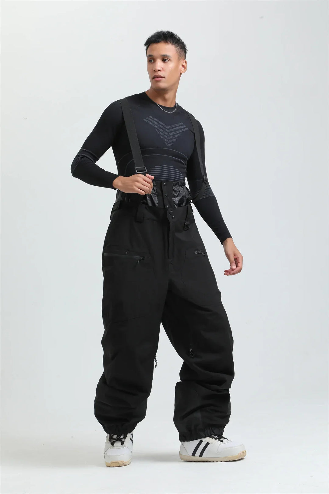 Pantaloni unisex impermeabili da sci e snowboard, blu navy, con bretelle per sport invernali.