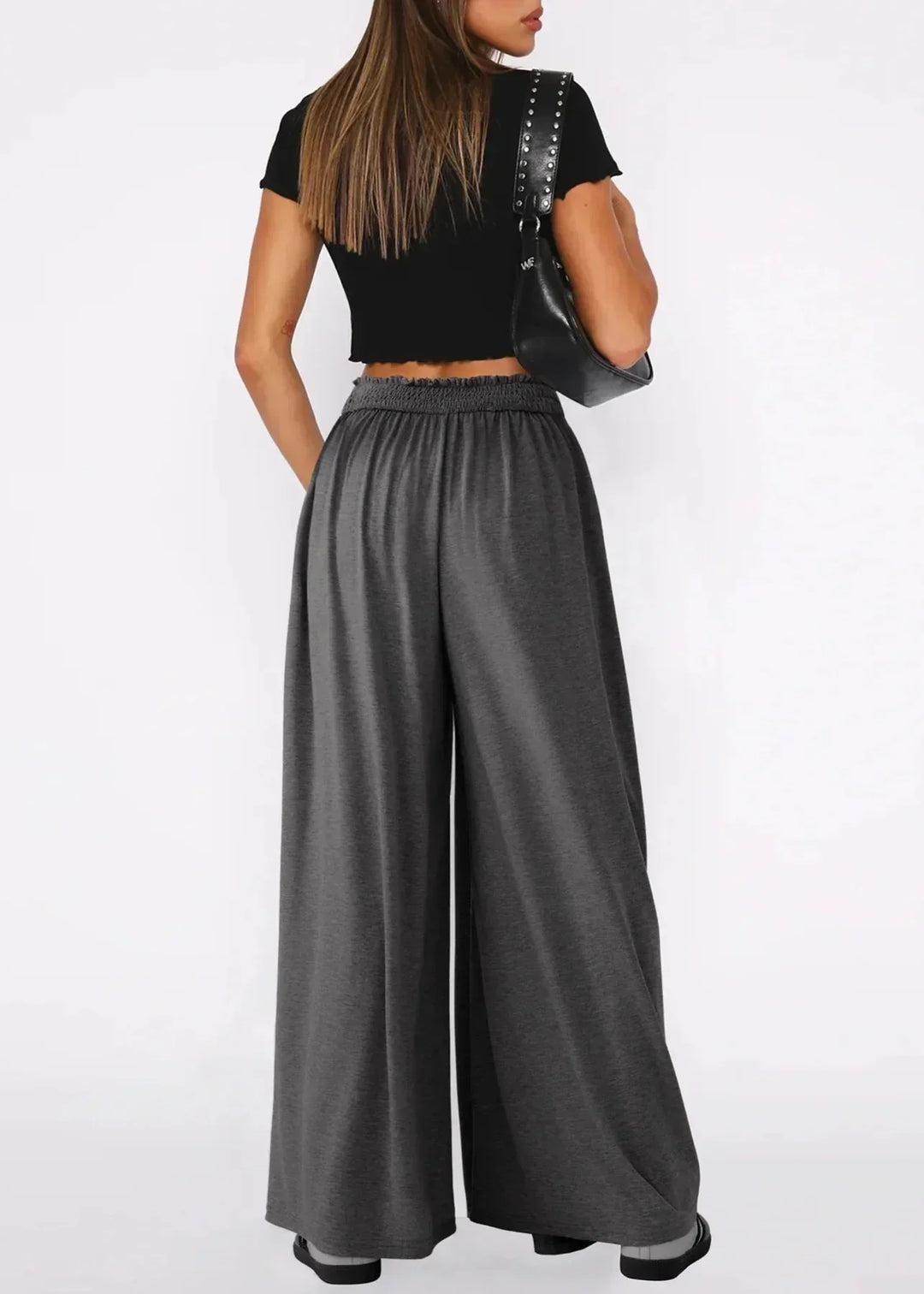 Pantaloni estivi da donna, gamba ampia, vita elasticizzata. Il comfort incontra lo stile casual.