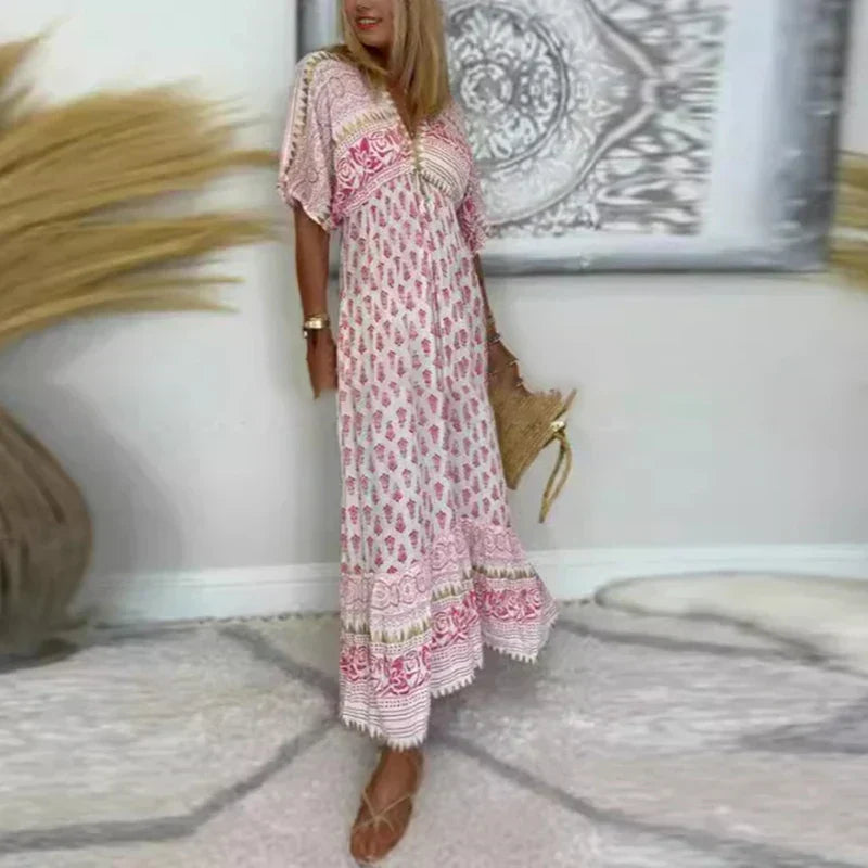 Vestito maxi donna bohémien con maniche corte, stampa fiori vivace e scollo a V, ideale per l'estate.